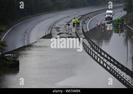 Flooding which has closed the A555 in Stockport Manchester Stock