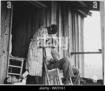 Harmony Community, Putnam County, Georgia. Getting shaved for a trip to town.; Scope and content:  Full caption reads as follows: Harmony Community, Putnam County, Georgia. Getting shaved for a trip to town. Stock Photo