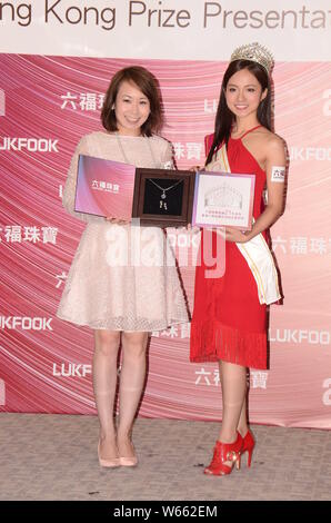 Miss Hong Kong Pageant 2018 first runner-up Amber Tang, right, receives her prize during the Miss Hong Kong Prize Presentation Ceremony 2018 in Hong K Stock Photo