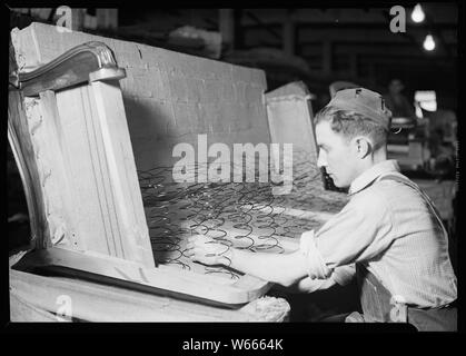 High Point, North Carolina. - Upholstering. Tomlinson Chair Manufacturing Co. Springing-up in a sofa. Stock Photo