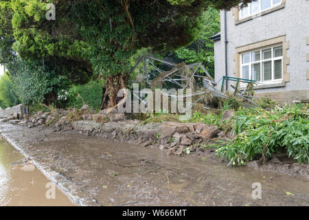 Reeth, Swaledale, North Yorkshire UK. 31st July 2019. UK Weather.  As floodwaters recede in Reeth the damage to property becomes clear and the cleanup begins. Credit: David Forster/Alamy Live News Stock Photo