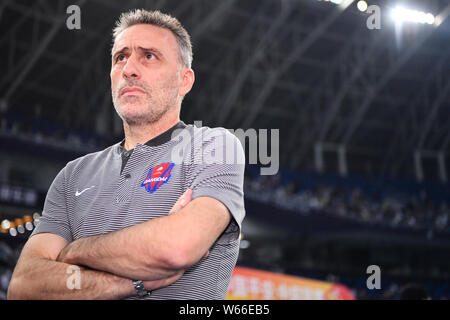 Head coach Paulo Bento of Chongqing SWM watches his players competing against Tianjin TEDA in their 13th round match during the 2018 Chinese Football Stock Photo