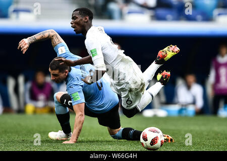 Presnel Kimpembe, right, of France challenges Jose Maria Gimenez of Uruguay in their quarterfinal match during the 2018 FIFA World Cup in Nizhny Novgo Stock Photo