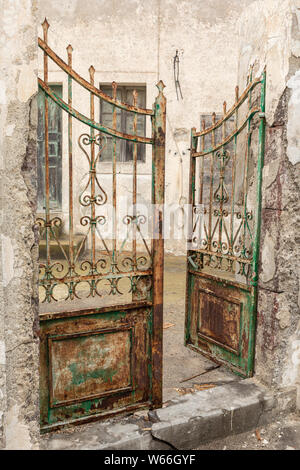 Rusty old open gates in Mesaria, Santorini, Greece Stock Photo