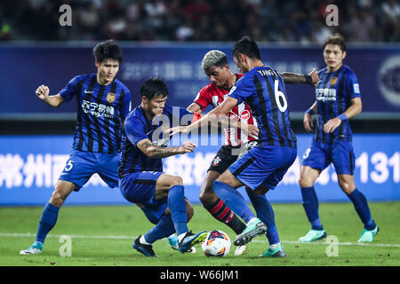 Mario Lemina, center, of Southampton F.C. dribbles against Jiangsu Suning in their friendly match during the 2018 Clubs Super Cup in Xuzhou city, east Stock Photo