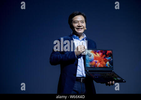 --FILE--Lei Jun, Chairman and CEO of Xiaomi Technology and Chairman of Kingsoft Corp., introduces the Mi Notebook laptop computer suitable for gaming Stock Photo