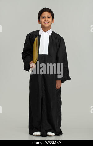 Boy pretending to be a lawyer and smiling Stock Photo