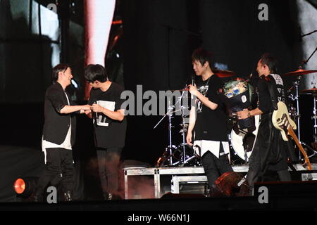 Japanese musician and singer Teruhiko Kobashi, better known by his stage name TERU, of rock band GLAY, and members of Taiwanese rock band Mayday perfo Stock Photo