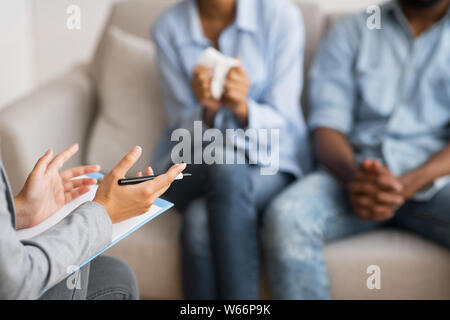 Psychologist counselling young african american married couple Stock Photo