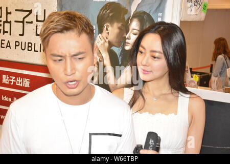 Hong Kong-based Japanese model Rina Matsuoka, also known as Linah, and Hong Kong actor Justin zhang attend a promotional event for 'Deception of the n Stock Photo