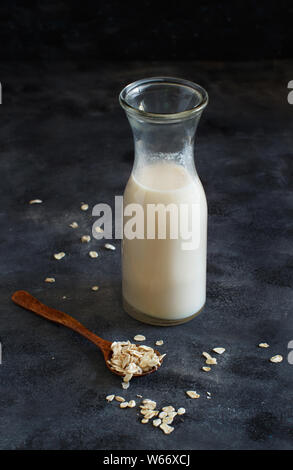 Vegan oat milk, non dairy alternative milk in a small bottle close up Stock Photo