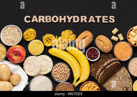 Healthy food with carbohydrates on black background Stock Photo