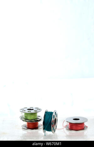 Sewing machine parts isolated on white background Stock Photo - Alamy