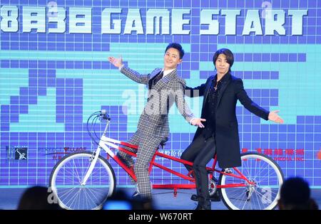 Chinese actor and singer Han Geng, left, and Japanese actor and singer Tomohisa Yamashita, also widely known as Yamapi, attend a press conference for Stock Photo