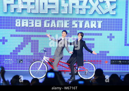 Chinese actor and singer Han Geng, left, and Japanese actor and singer Tomohisa Yamashita, also widely known as Yamapi, attend a press conference for Stock Photo