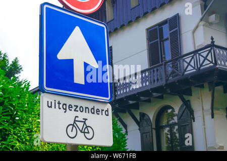 3 Dutch traffic signs in front of an old Dutch house Stock Photo
