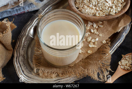 Vegan oat milk, non dairy alternative milk in a glass close up Stock Photo