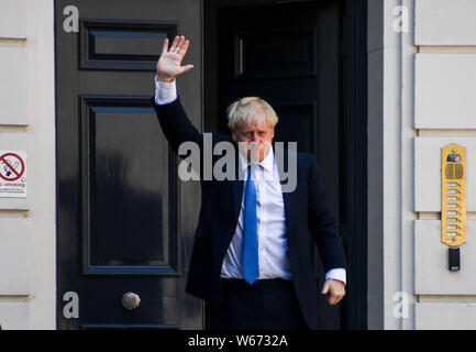 (190731) -- BEIJING, July 31, 2019 (Xinhua) -- Newly elected Conservative party leader Boris Johnson poses outside the Conservative Leadership Headquarters in London, Britain on July 23, 2019. (Photo by Alberto Pezzali/Xinhua) Stock Photo