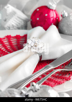 Red and silver Christmas ornaments border on silver background Stock Photo