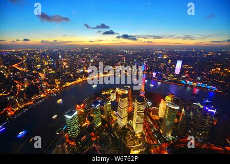 This picture taken from high in the Shanghai Tower shows the skyline of Puxi, Huangpu River and the Lujiazui Financial District with the Oriental Pear Stock Photo