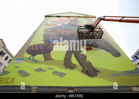 View of the wall painting 'Troubadours' created by Spanish artist Dulk with the theme on care of children and animals on a residential building on Don Stock Photo
