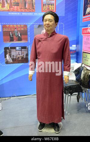 --FILE--A humanroid robot featuring Chinese xiangsheng actor Yu Qian is on display at China International Robot Show (CiROS) 2018 in Shanghai, China, Stock Photo