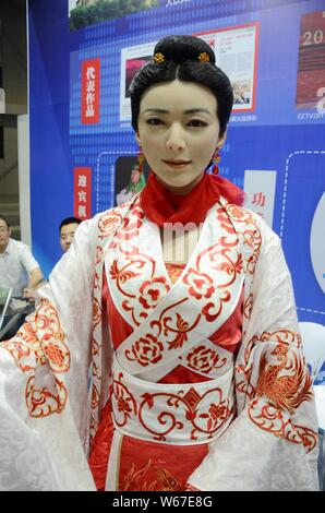 --FILE--A humanroid robot is on display at China International Robot Show (CiROS) 2018 in Shanghai, China, 4 July 2018.   Humanroid robots featuring C Stock Photo