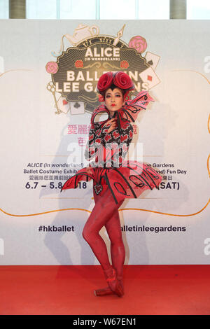 A ballet dancer poses at a city parade event for the Asia debut of ...