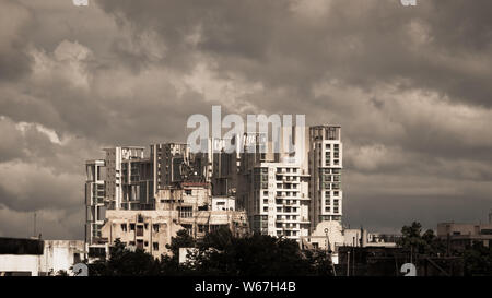 Delay Monsoon Rainy day city. Kolkata, Bengal India. Heavy Stormy rain clouds up above highrise. Storms and dark monsoons typical modern residential s Stock Photo