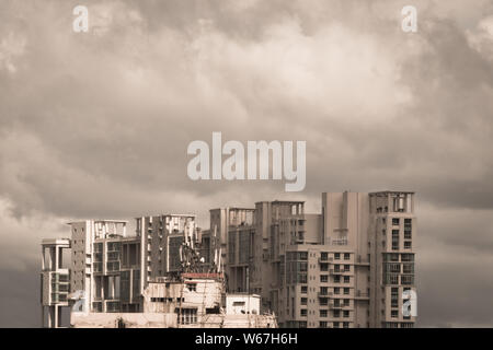 Storms dark Early monsoons over modern residential skyscrapers. Kolkata, Bengal India. Monsoon Rainy day city in evening. Heavy Stormy rain clouds up Stock Photo