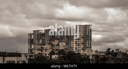 Heavy Stormy rain clouds up above highrise. Early Monsoon Rainy day city. Storms and dark monsoons typical modern residential skyscrapers. Kolkata, Be Stock Photo