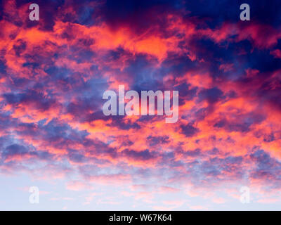 Sky at sunset with pink/orange clouds Stock Photo