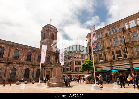 St Ann's Church consecrated in 1712 viewed from St Anne's Square, business and shopping area in central Manchester. Stock Photo