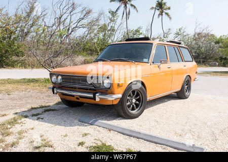 A well kept vintage Datsun 510 station wagon parked in a lot by the beach at Bahia Honda State Park in Florida, USA Stock Photo