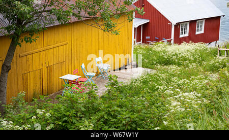 Wooden fishermans huts used as tourist accomodations in Nusfjord, Lofoten islands, Norway Stock Photo