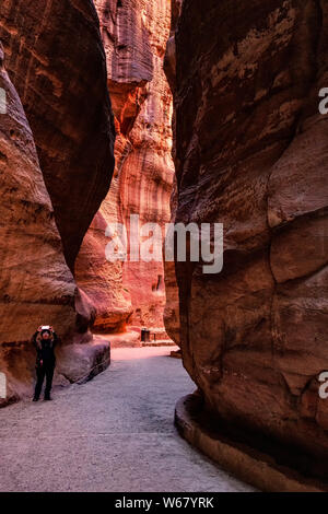 Al Siq the narrow passage through the gorge leading to the ancient Nabataean city of Petra Stock Photo