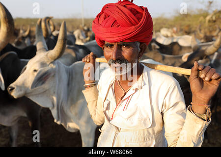 Rabari herder in a rural village in the district of Kutch, Gujarat. The Kutch region is well known for its tribal life and traditional culture. Stock Photo