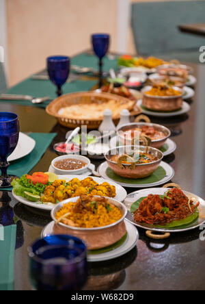 Various Indian food with meat, curry, soup and spicy taste on the table in restaurant Stock Photo