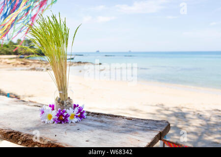 Table with decoration at beach bar, Krabi, Thailand Stock Photo