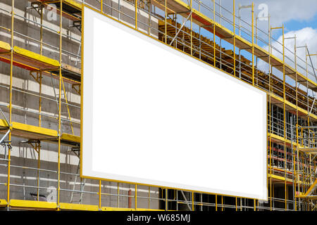 advertisement billboard on scaffolding / signboard on building facade Stock Photo