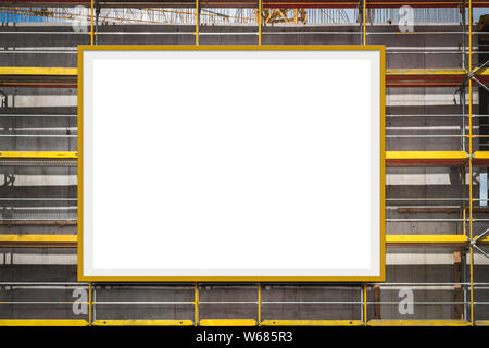 blank advertisement billboard on scaffolding / building facade Stock Photo