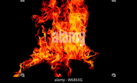Fire flames on Abstract art black background, Burning red hot sparks rise from large fire in, Fiery orange glowing Stock Photo