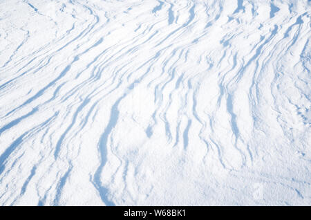 Abstract natural winter background texture, snow surface with nice curved shadows Stock Photo