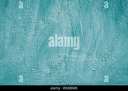 Green abstract background of concrete wall. Blue cement texture. Acrylic turquoise painted wall. Pattern. Creative card in modern style. Textured Stock Photo
