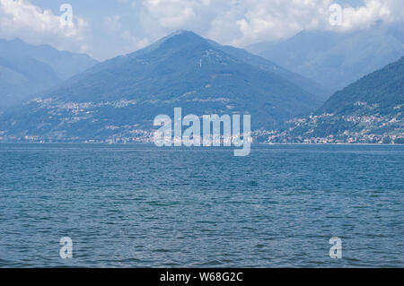 View of mountain lake on a sunny summer day. District of Como Lake, Colico, Italy, Europe. Stock Photo