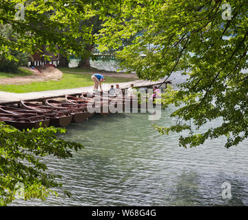 People enjoying Plitvice Lakes National Park, Croatia. A UNESCO World Heritage site, this natural wonder contains 16 lakes interconnected by rivers. Stock Photo