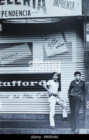 Fine black and white art photography from the 1970s of two Mexican men hanging out on the street. Stock Photo