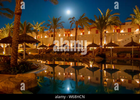 Full moon reflecting in a swimming pool Stock Photo