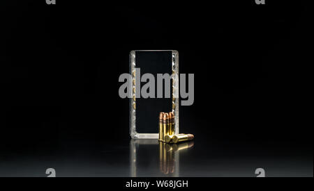 .22LR cartridge gun on dark background Stock Photo