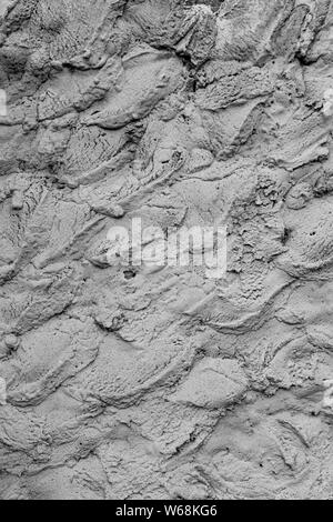 Rough cement plaster on the wall. Facade plaster background. Single-ply monolithic plaster decorative background. Single layer scraped cement plaster Stock Photo